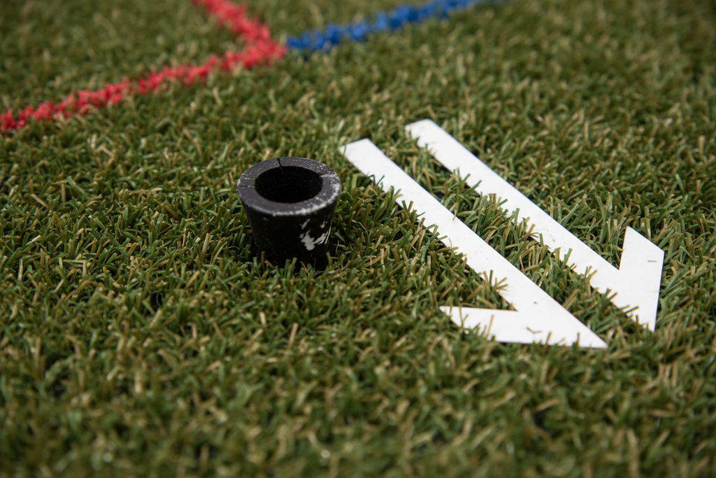 Close-up of premium turf texture with tee holder