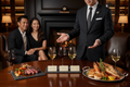 Club sommelier presenting wine flight with tasting cards